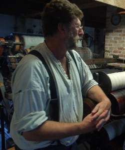 Ron in front of a carding machine