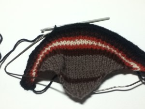 crocheting the tail onto a coat hanger
